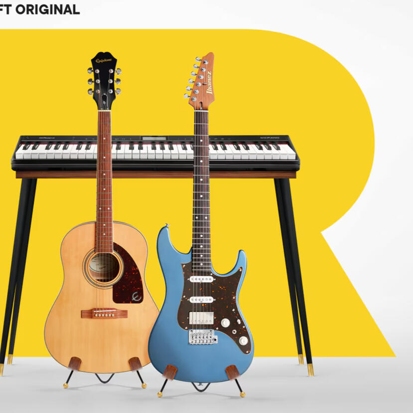 Cover art from Rocksmith+, there's an acoustic and blue electric guitar standing in front of a keyboard. There's a yellow R behind all of the instruments